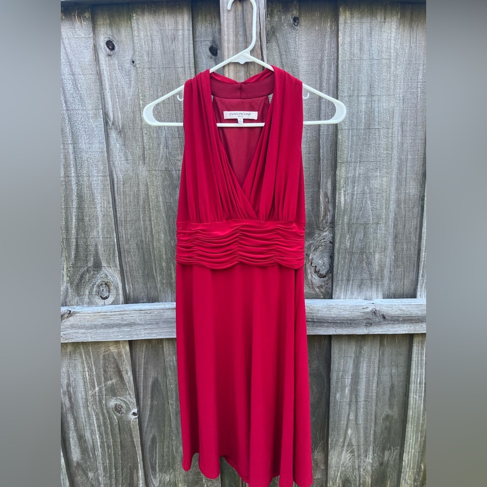 This red Evan Picone dress is light weight elegant and easy to move around in!